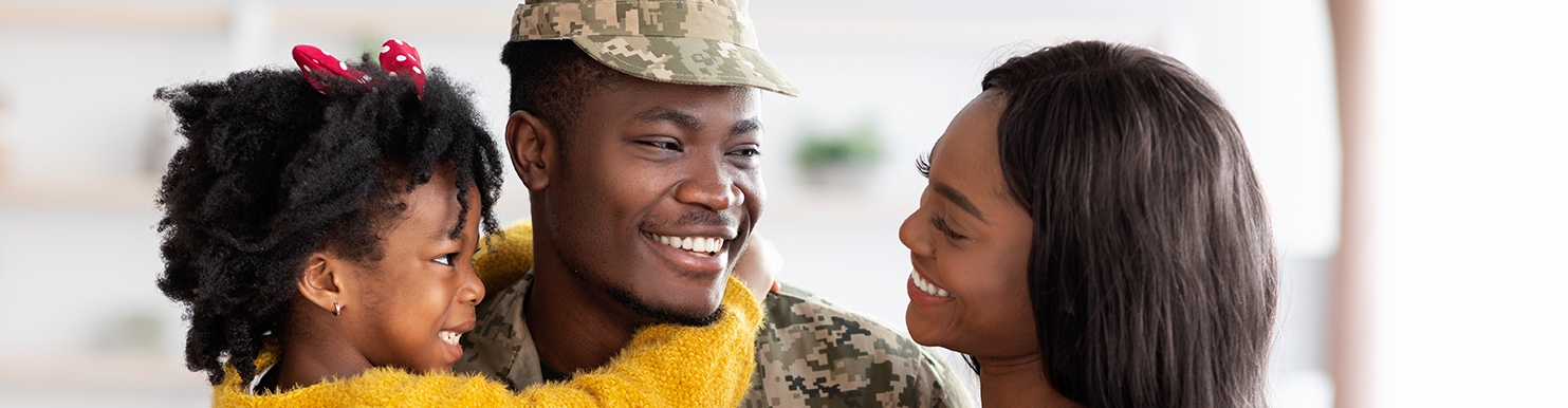 Happy Black Wife And Daughter Welcoming Military Father At Home After Army