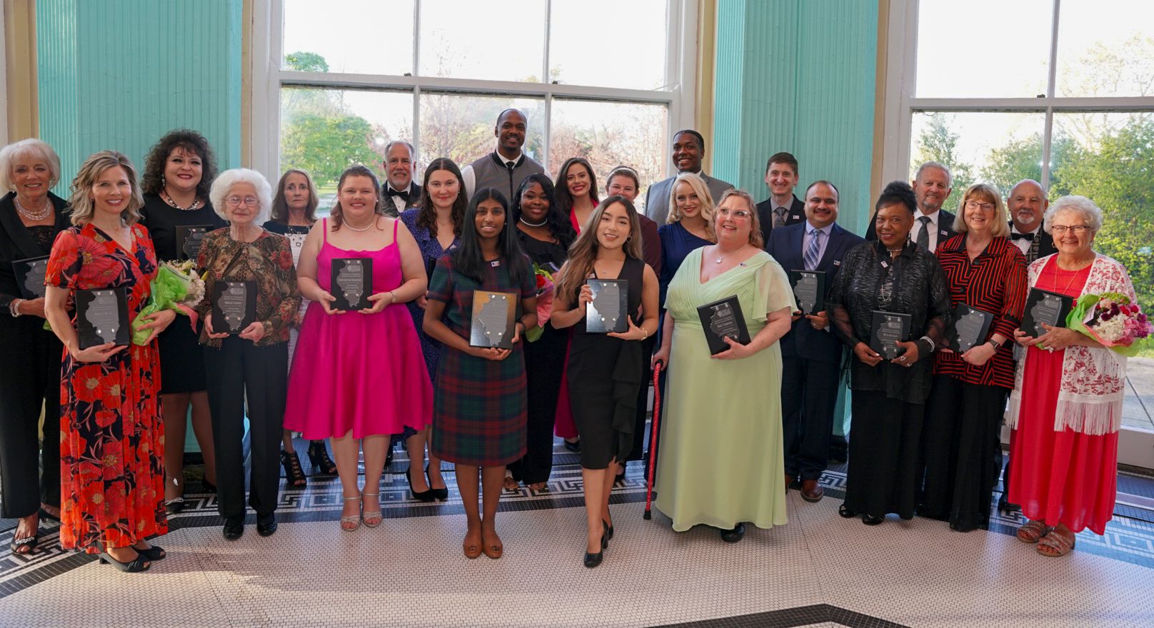 Group picture of the Governor's Volunteer Service Awards winners with their awards 
