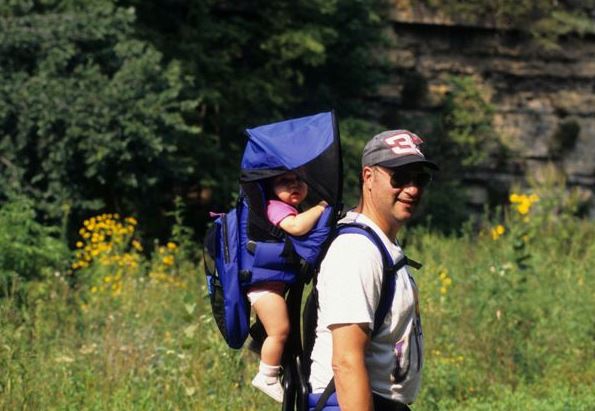 Hiker with a young child in backpack