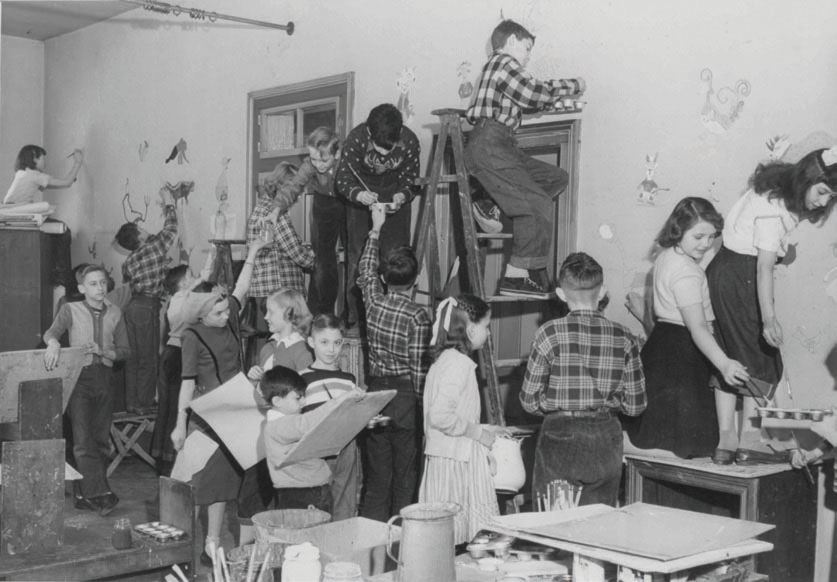 Children painting murals at the Springfield Art Association