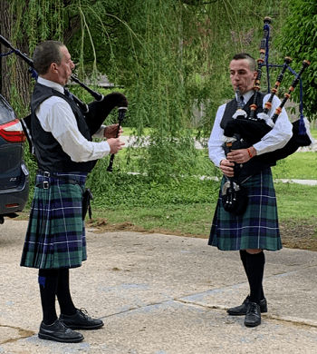 Damon and Aidan playing bag pipes