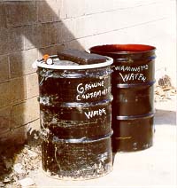 Drums of gasoline-contaminated water (19723 bytes)