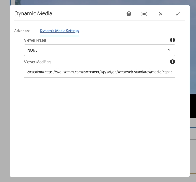 The Dynamic Media authoring dialog window with the Dynamic Media Settings tab selected. The Viewer Preset dropdown and Viewer Modifiers input fields displayed. The Viewer Modifiers field includes the caption file location..