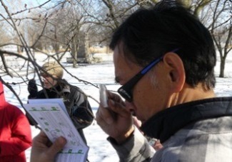 ENTICE Participant using magnifying glass