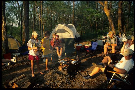 camping families gathered around the campfire