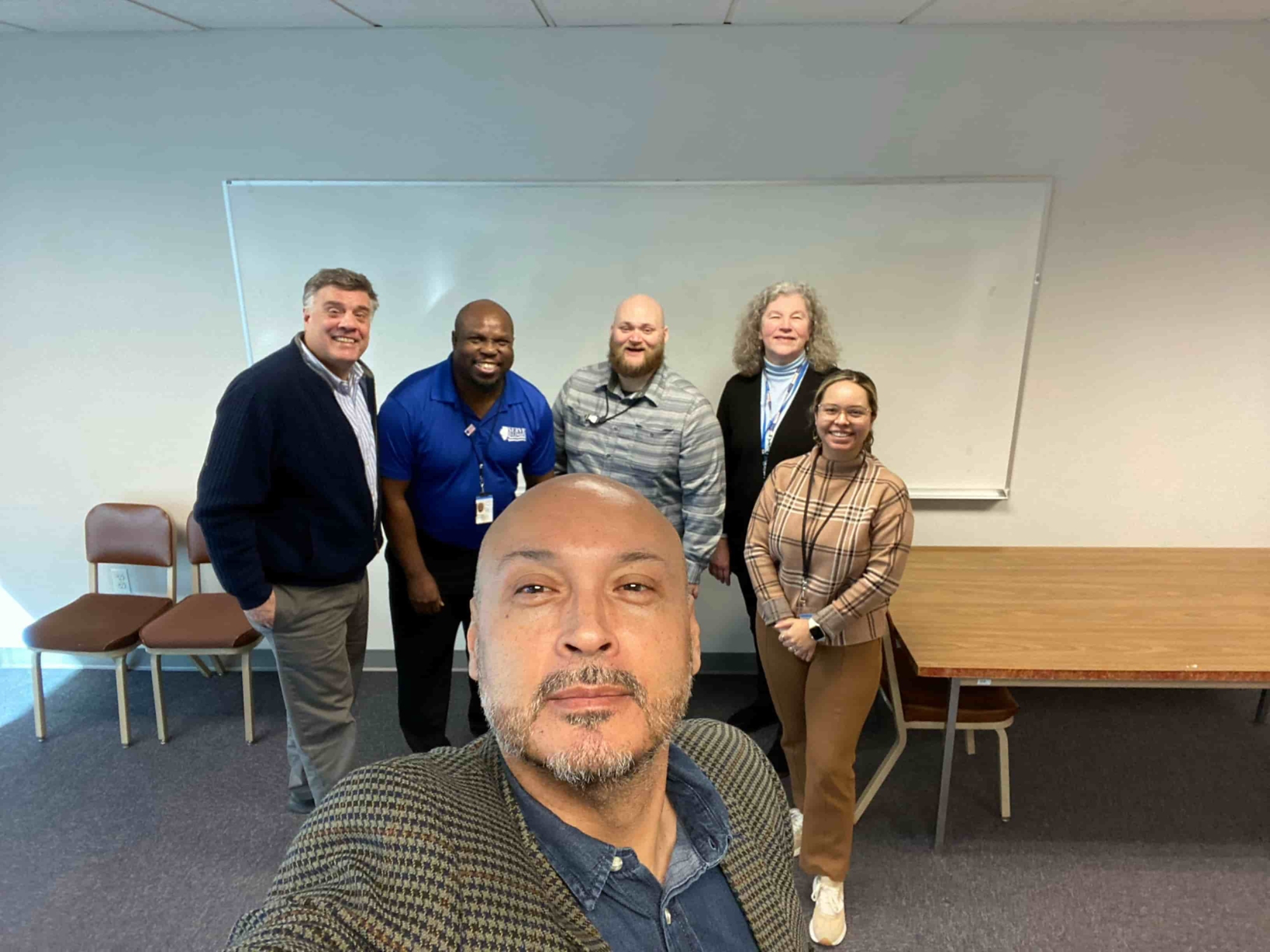 Serve Illinois team Andres Fernandez, Jacob Jenkins, Cecilia Maciel Martinez, along with Anne Robertson and Tim Little from Federal Emergency Management Agency, and Serve Illinois Commissioner John Gremer at IDHS offices in Chicago.