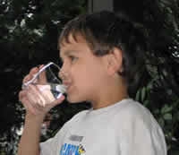 Child drinking water from a glass