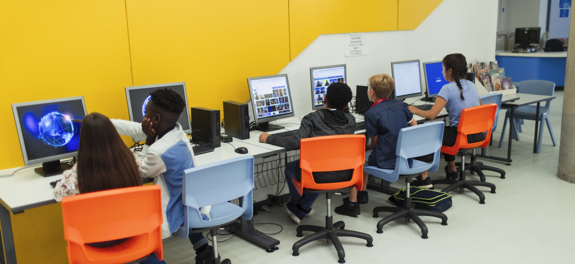 Junior high students using computers in computer lab