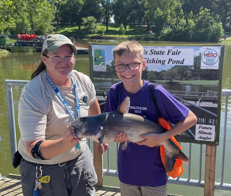 Photo of boy holding large catfish