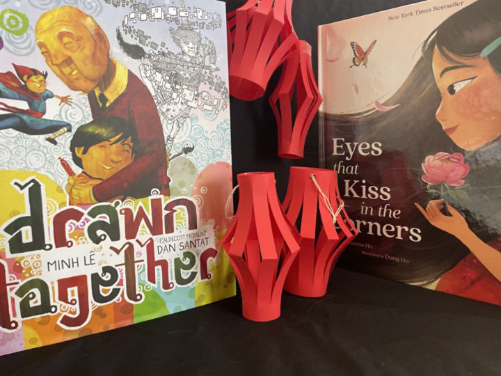 Two books presented with red paper lanterns 
