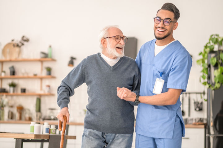 nurse helping senior patient