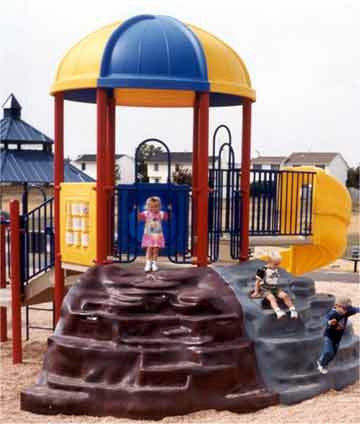 children play on playground equipment