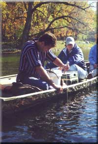 Bureau of Water employees using seccki disk to check water clarity