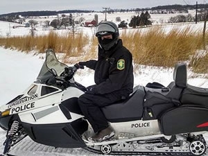Conservation Officer on a Snowmobile