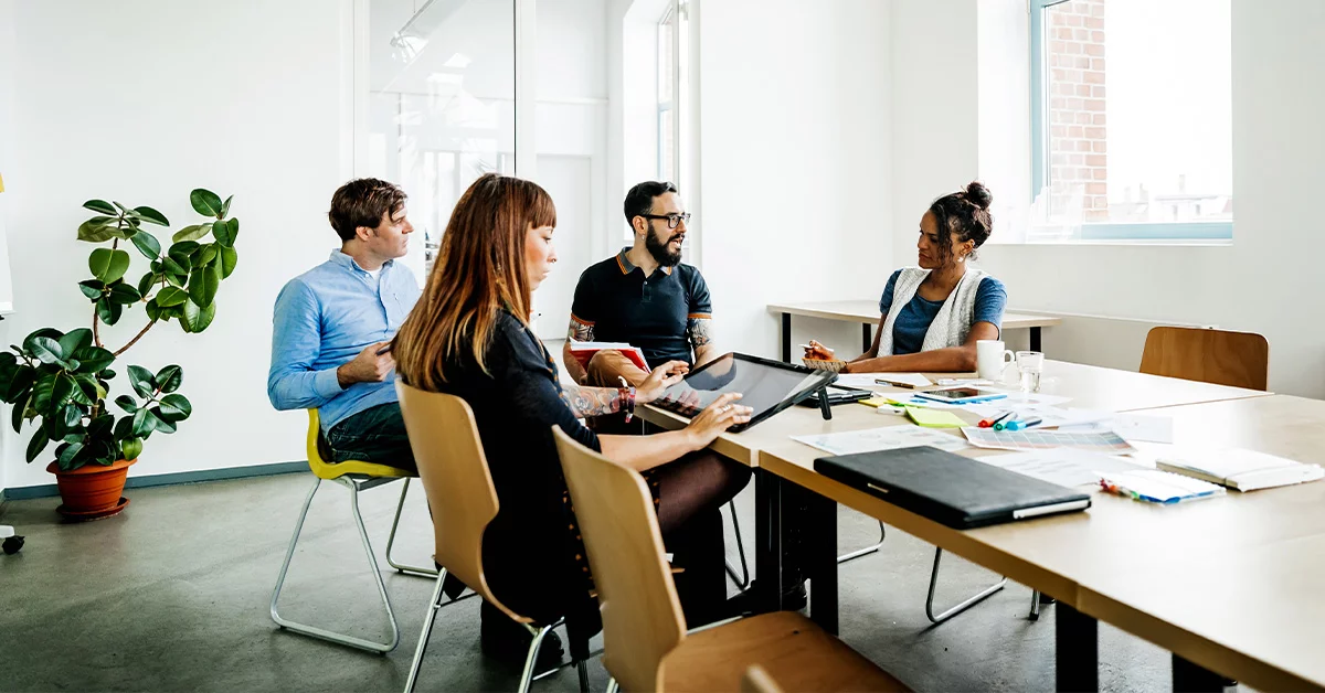 Diverse group collaborating in office environment