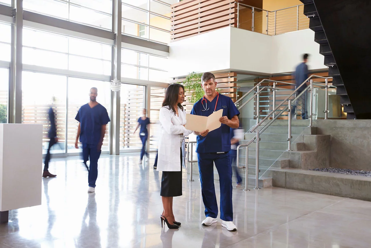 Doctors looking into a file in a hospital