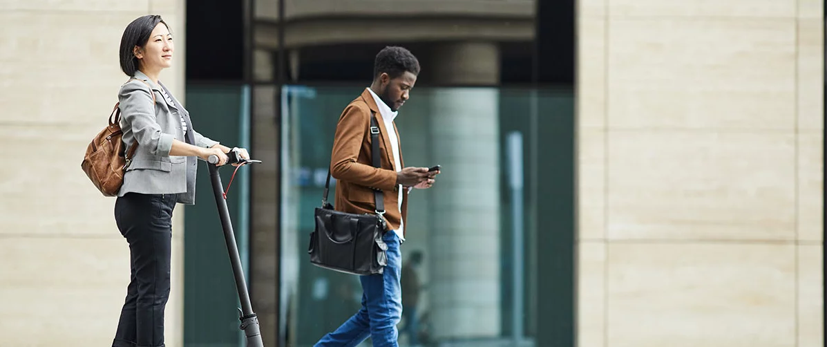 People walking past an office building
