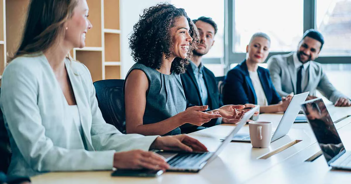 People smiling in a meeting