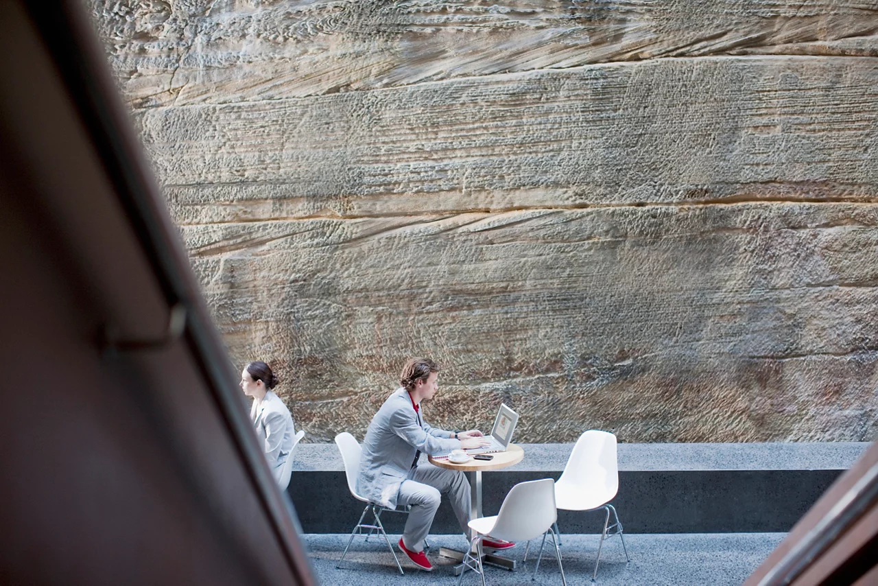 Businessman using laptop at table