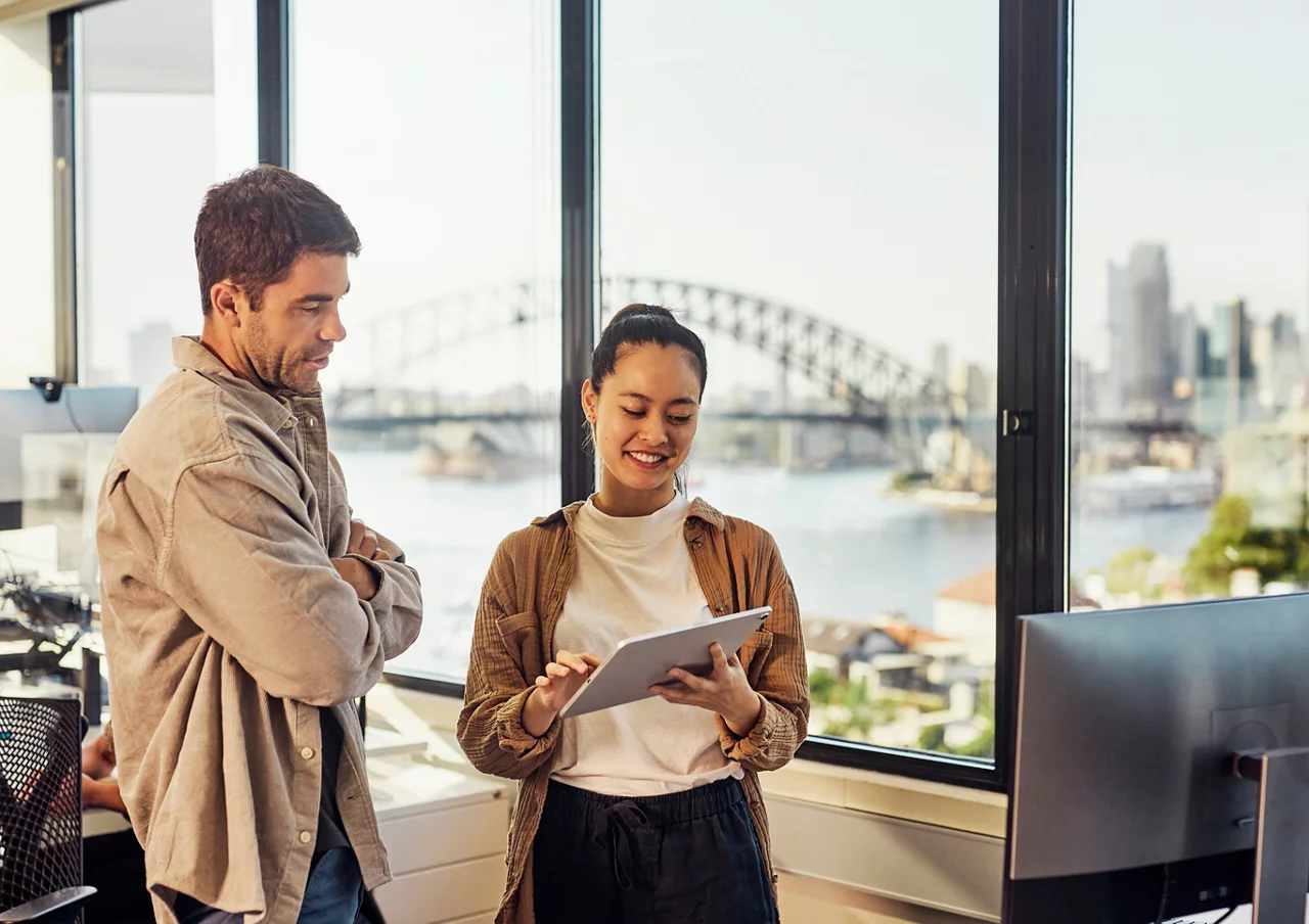 A diverse team of Australian professionals collaborating in a Sydney office.
