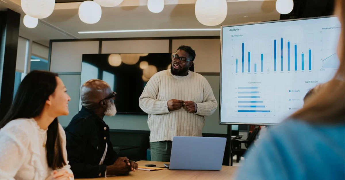Employees discussing on business intelligence analytics dashboards real time data