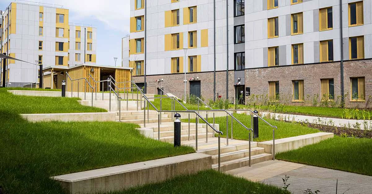 Grassy area with steps leading up to a building
