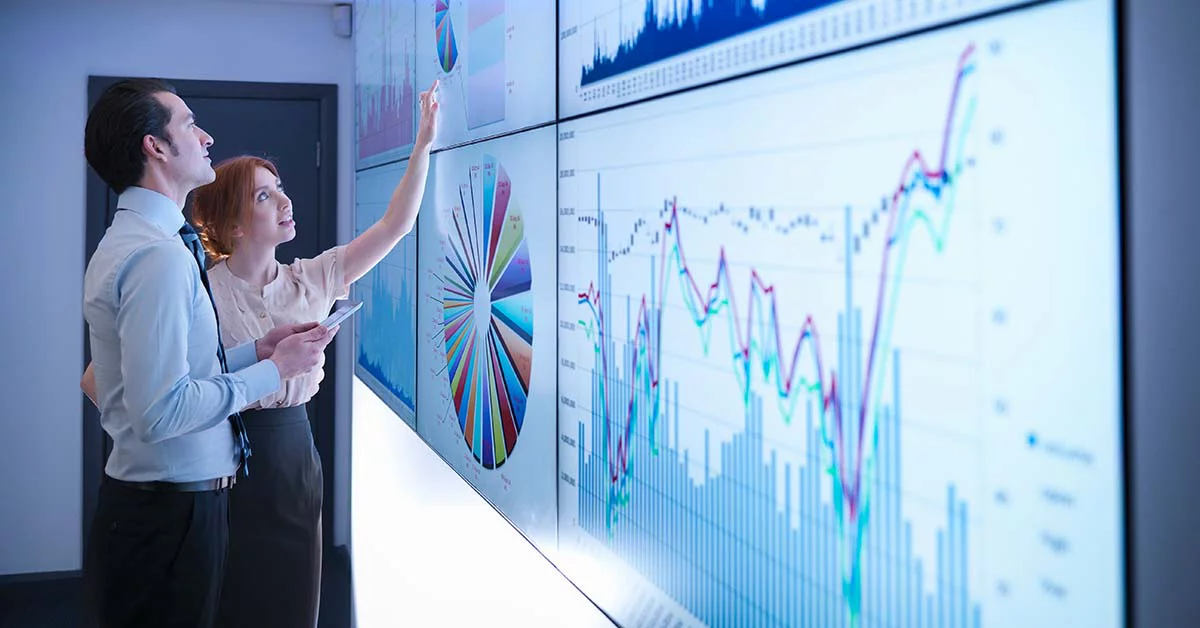 Men and women discussing about various data
