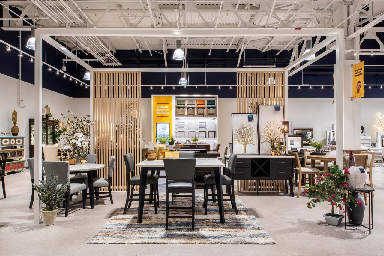 JLL's modern dining room display showcases how the new store concept elegantly merchandises furniture collections, inspiring customers to envision complete room designs for their homes.