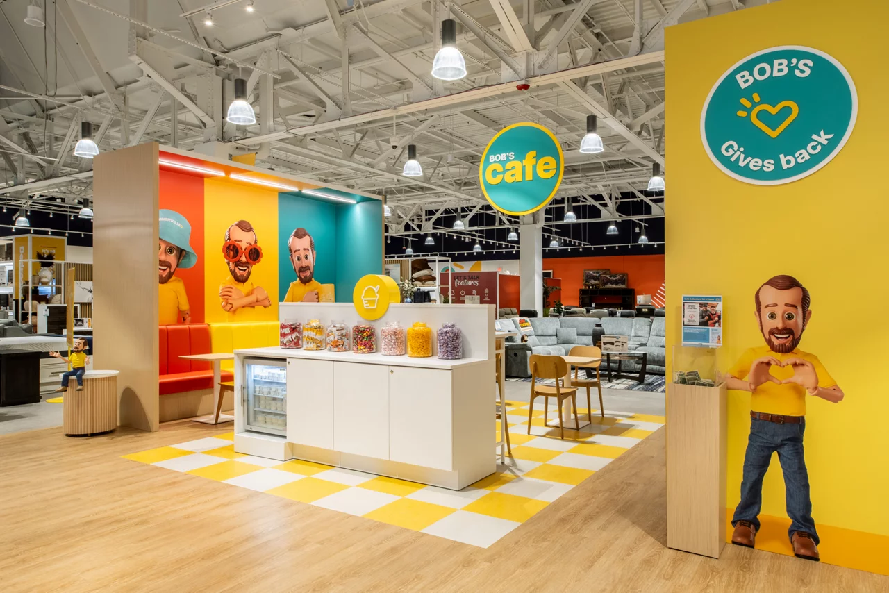 The colorful seating area in Bob's Café showcases the brand's distinct personality with bright orange, yellow, and turquoise booths that embody a sense of comfort, value and fun.