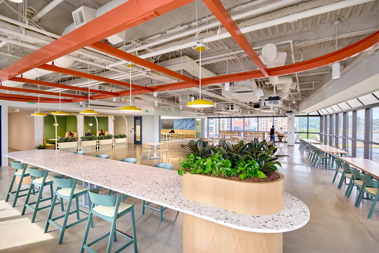 Modern office cafeteria or collaborative workspace with industrial-style