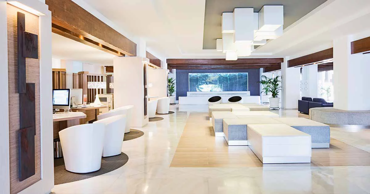 Stylish hotel lobby with minimalist white furniture and a bright