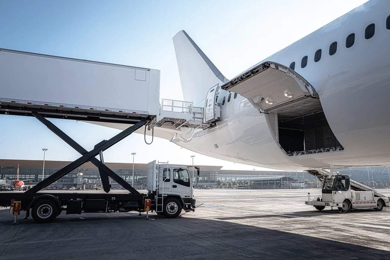 The airport is loading the plane with supplies