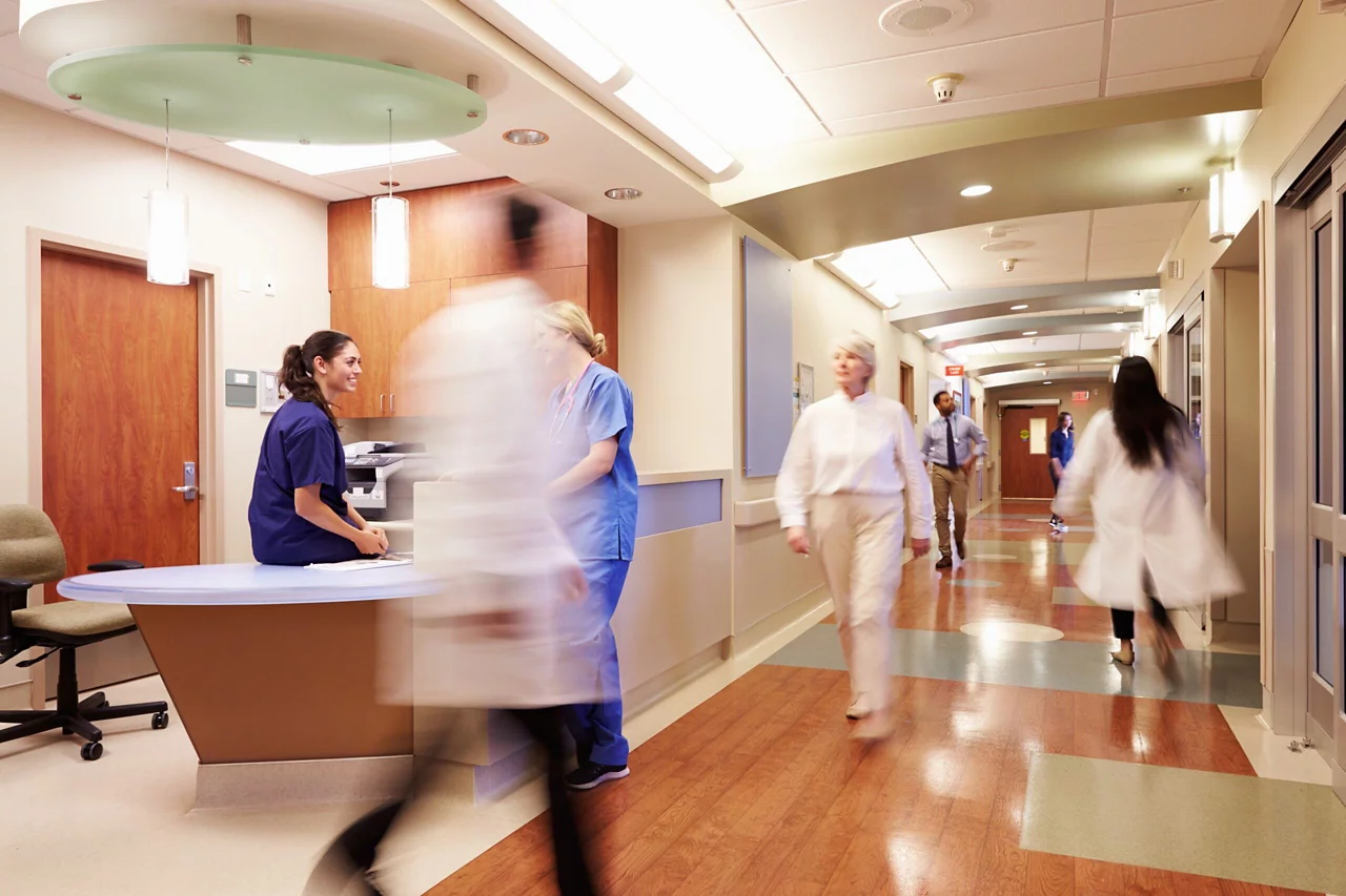 Doctor and nurses walking through lobby and reception