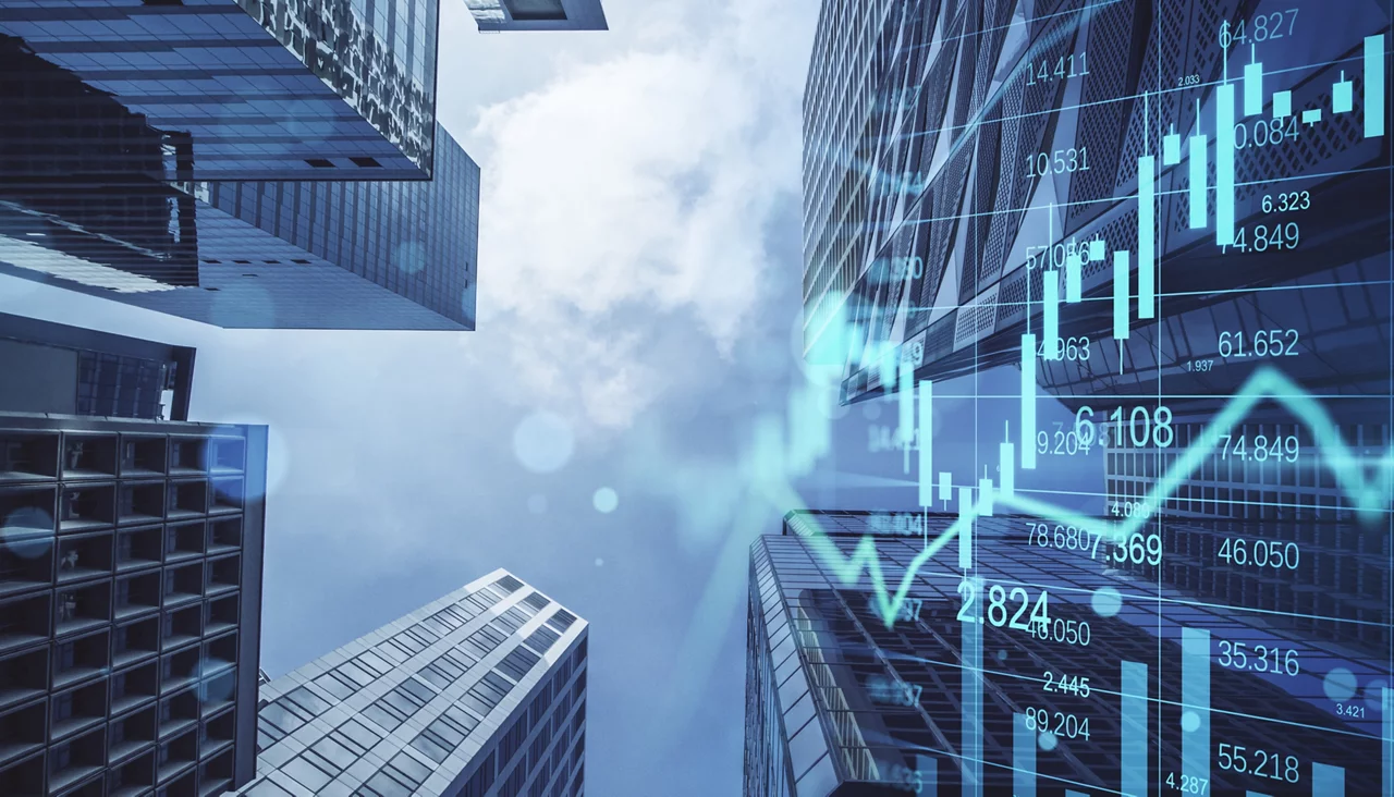 Real estate, development and investing concept with financial chart indicators and stock market graphs on city skyscrapers