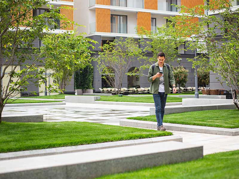 A man walks through a park