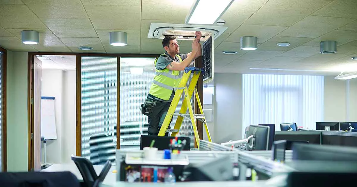A man standing on a ladder