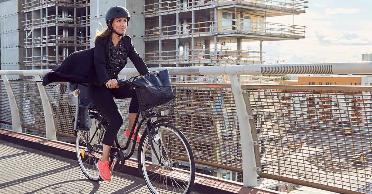 A lady is riding a bicycle