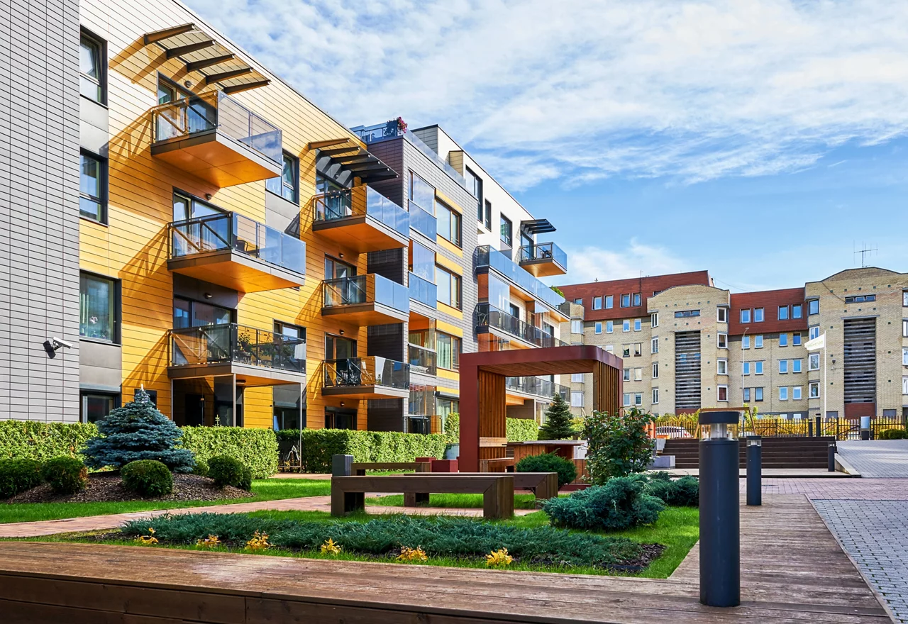 Modern complex of apartment residential buildings. With many benches and outdoor facilities.