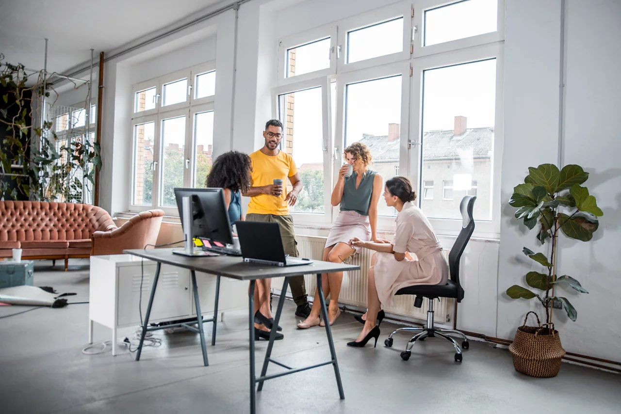 Group of business colleagues brainstorming new business ideas together in the office