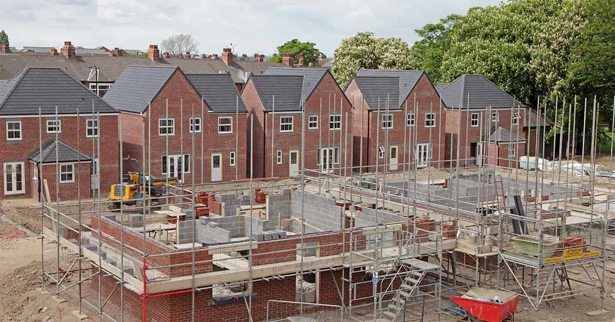 Red brick houses under construction.