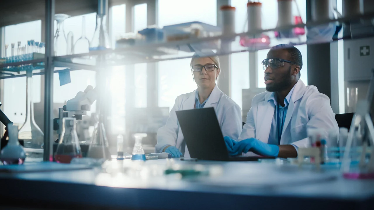 young doctors in a lab working on laptop
