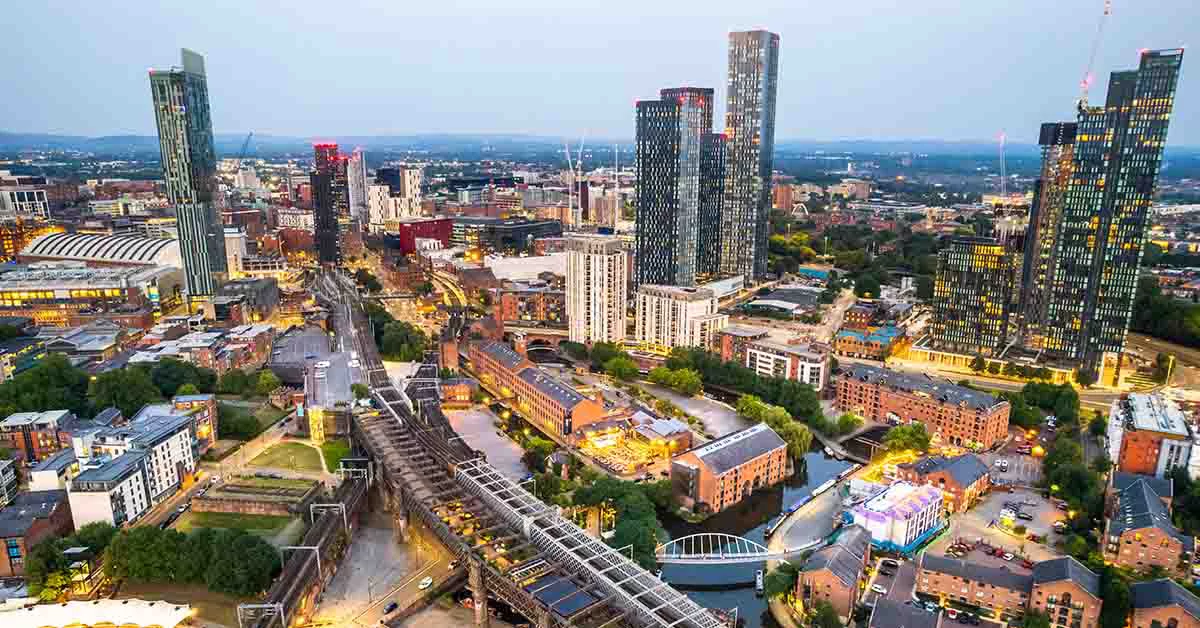 Manchester aerial shot of modern buildings in the central area of the city with historic canals and railways
