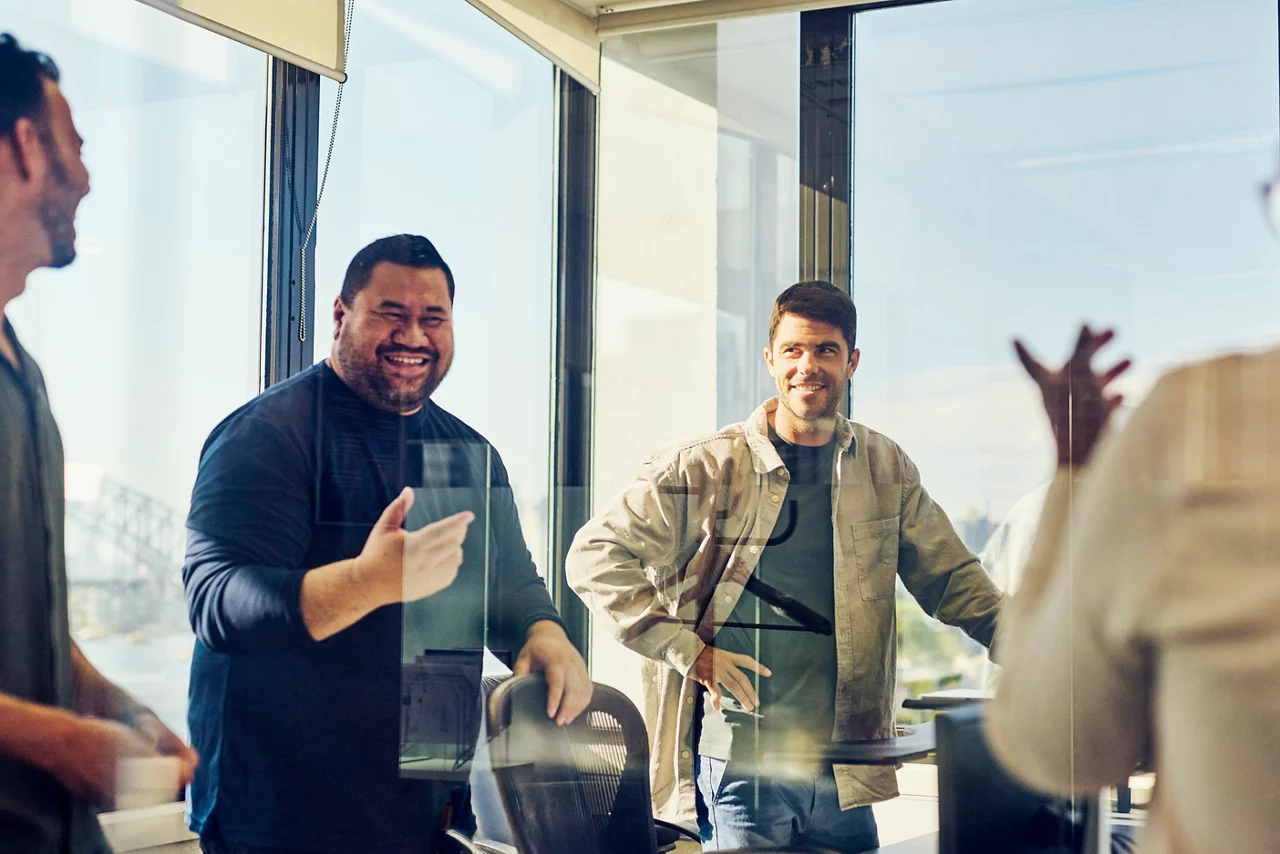 A diverse team of Australian professionals collaborating in a Sydney office.