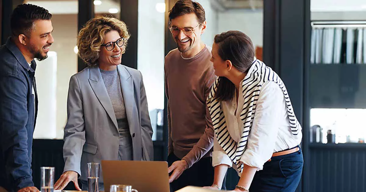 Employees discussing something in office