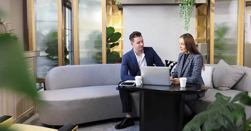 Colleagues working in office