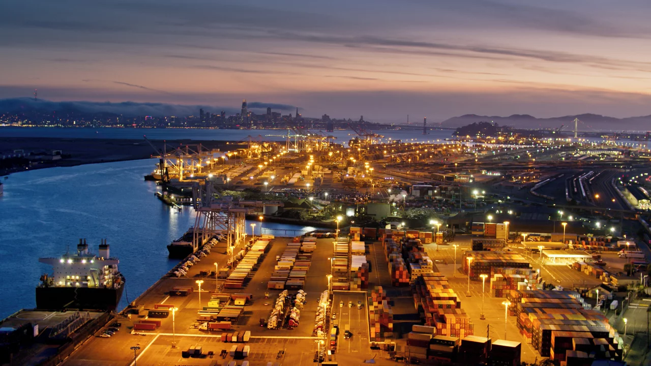 Aerial Shot of the Port of Oakland and the San Francisco Skyline at Dusk