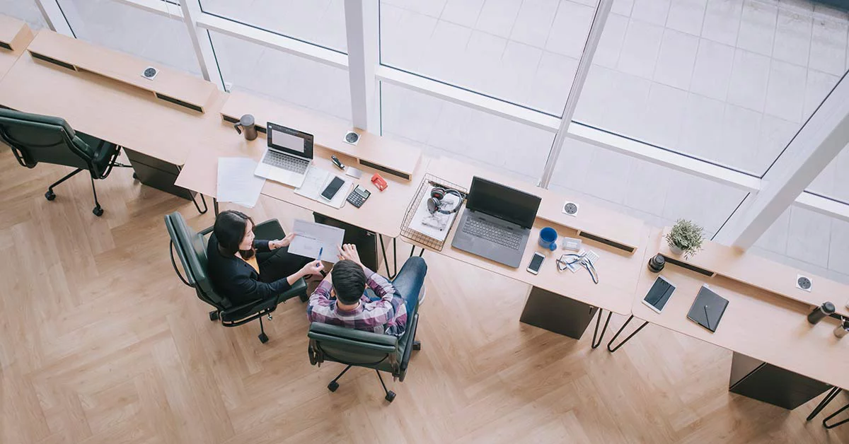 Facility managers in command center discuss building data