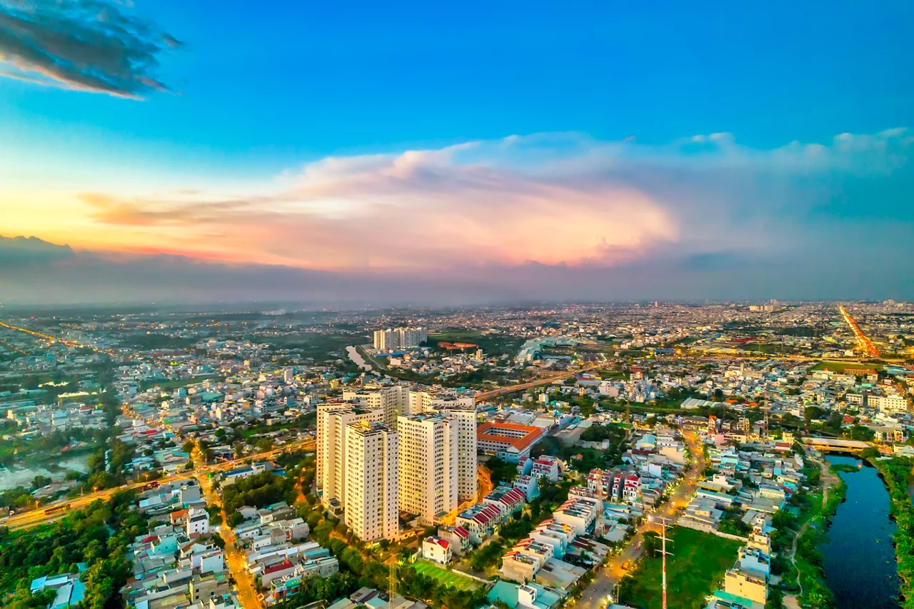 Aerial view of Saigon cityscape at evening with sunset sky in Southern Vietnam