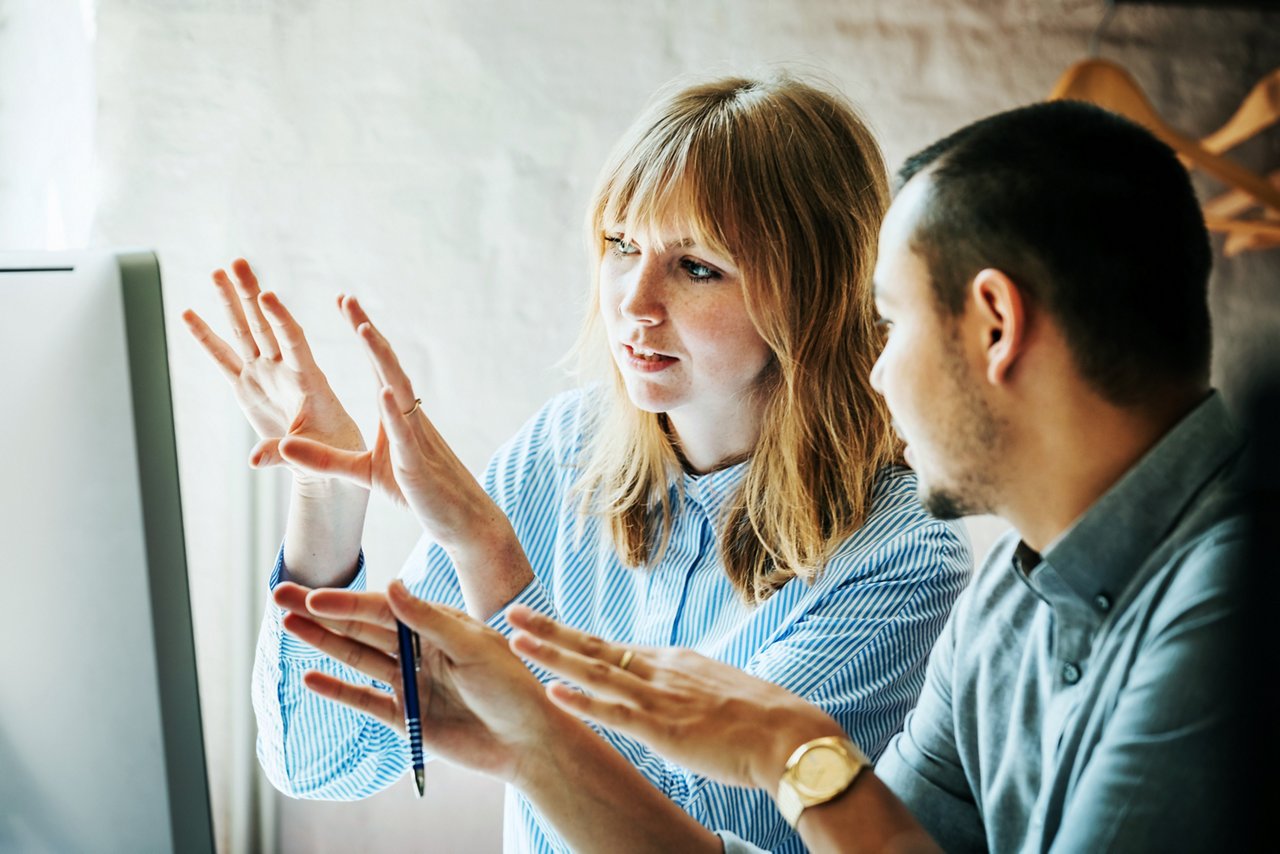 Young man and woman discussing something