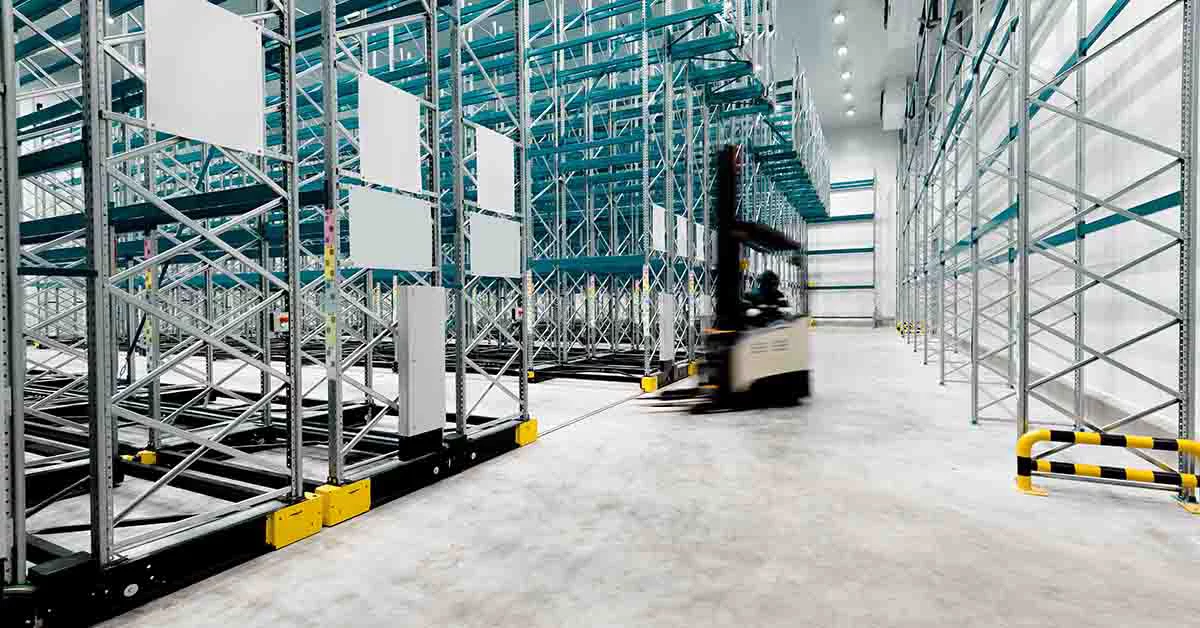 New cold room storage. Refrigeration and freezing warehouse with stacker truck inside moving